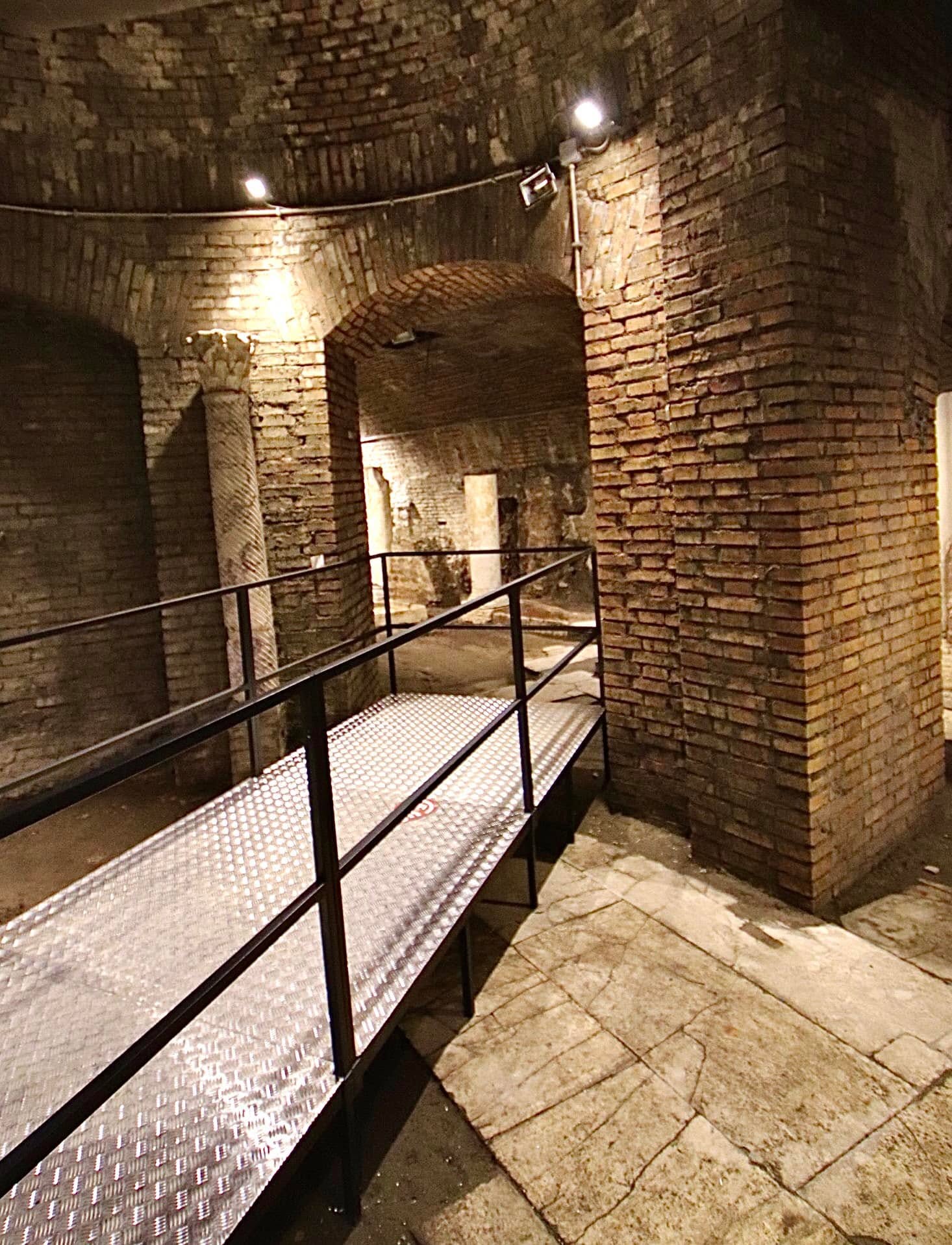Archaeological remains visible beneath Rome