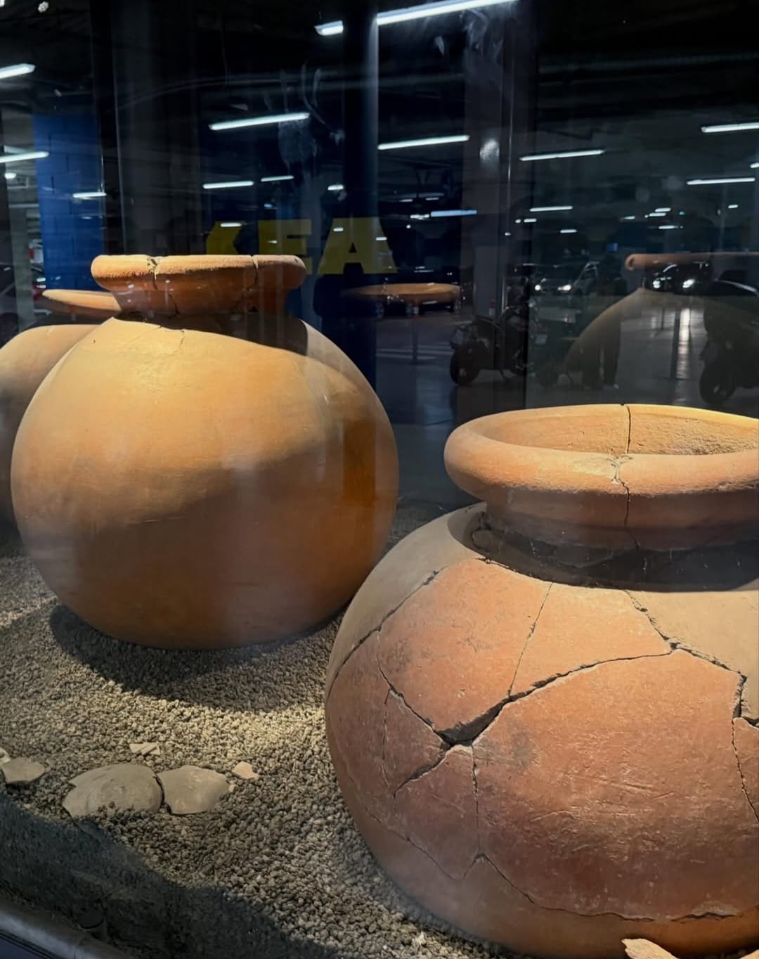 Archaeological display of large ceramic storage containers at IKEA Anagnina